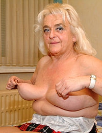 Big titted granny showing off her body